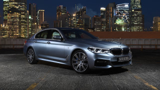 Silver car city skyline night 7 - a city skyline in the background free wallpaper for desktop