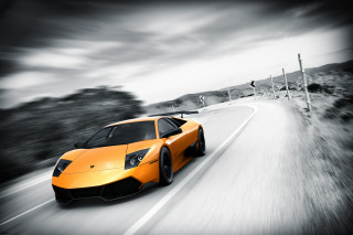 Yellow sports car cloudy road - motion blur free wallpaper