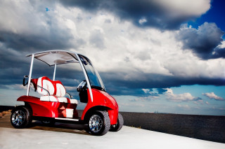Red golf cart ocean cloudy - a cloudy day free wallpaper