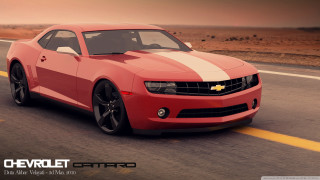 Red car driving road sky 3 - a red car free wallpaper