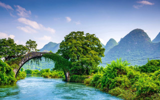 Bridge river mountains background water - a bridge in the middle free wallpaper