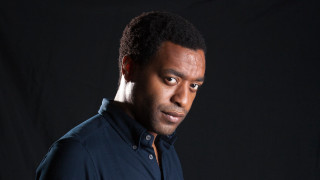 Man black shirt studio portrait - bruce onobrakpeya free wallpaper