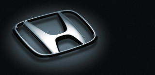 Car emblem closeup black background - letterism free wallpaper for desktop