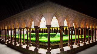 Gothic building through fence green - arch free wallpaper