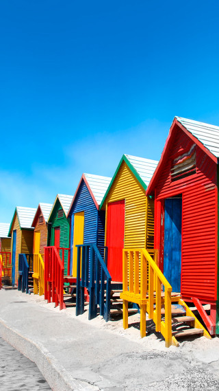 Colorful beach huts blue sky 2 - free summer wallpaper for mobile