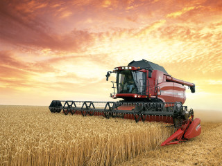 Red combine harvesting wheat cloudy - dahlov ipcar free wallpaper