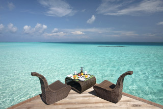 Tranquil dock table food boat - a boat in the distance free wallpaper