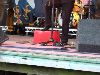 Man standing stage microphone speaker - a microphone free wallpaper