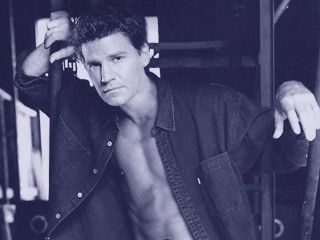 Man no shirt leaning wall - against a wall free wallpaper