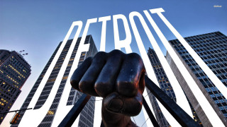 Hand metal giant cityscape Detroit - a hand holding free wallpaper