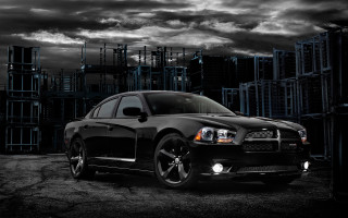 Black car building cloudy sky - a black car free wallpaper