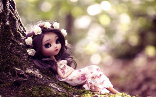Doll sitting ground tree woods - a doll free wallpaper