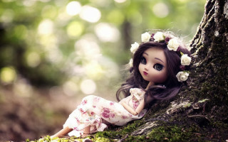 Doll sitting tree woods flowers - a doll free wallpaper