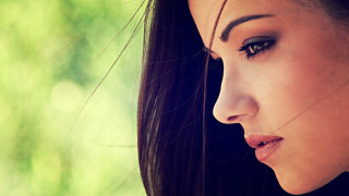 Woman longhair blackshirt greenbackground blurrytree - araceli gilbert free wallpaper