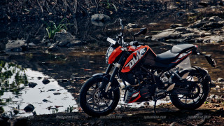 Motorcycle parked dirt road water - the bike free wallpaper