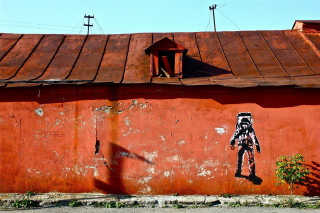 Robot painting red wall building - punk art free wallpaper