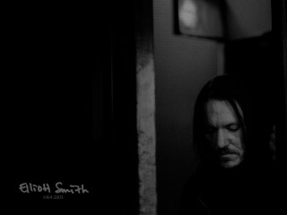 Man long hair doorway looking - free dark wallpaper