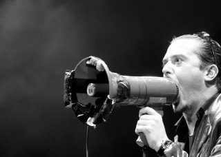 Man holding megaphone singing microphone - erwin bowien free wallpaper