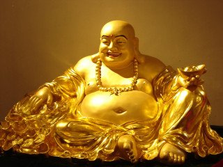 Golden buddha statue black table - a red rug free wallpaper