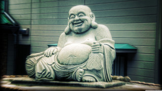 Laughing buddha statue green door - a green door free wallpaper