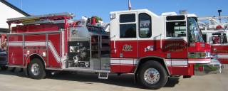 Fire truck parking lot building - front view free wallpaper