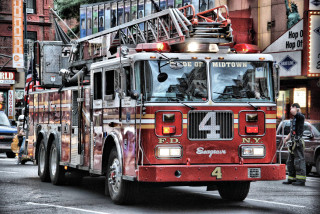Fire truck street tall building - a fire truck free wallpaper