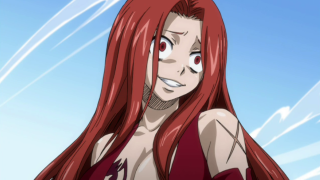 Woman red hair red dress - a blue sky behind her free wallpaper