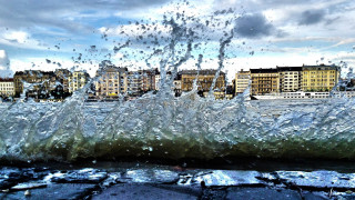 Large wave hitting ground buildings - florence engelbach free wallpaper