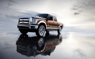 Truck parked reflective surface sky - a reflective surface free wallpaper