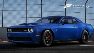 Blue sports car parked fenced - a fenced in area free wallpaper