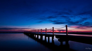 Dock poles sunset dawn blue - a long dock free wallpaper