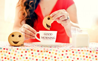 Woman holding cup cookie plate - a smiley face free wallpaper
