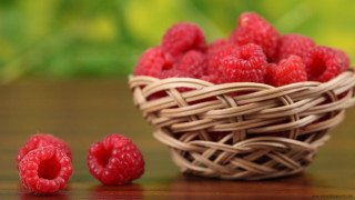 Basket raspberries table green background - berry free wallpaper