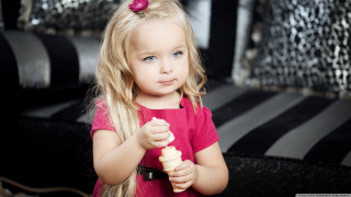 Little girl holding banana serious - a pink shirt free wallpaper