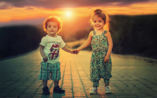 Two little girls holding hands - sunset time free wallpaper