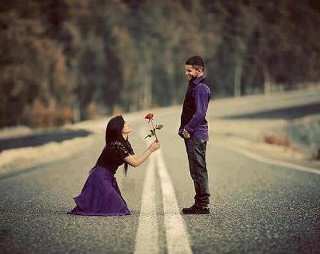 Man kneeling woman holding flower - the side of the road free wallpaper