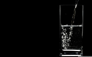 Glass water pour black background - a glass of water free wallpaper