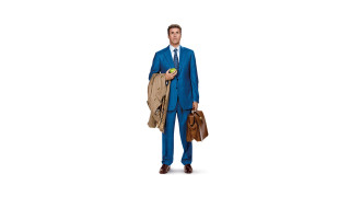 Man blue suit holding bag - a blue suit holding free wallpaper