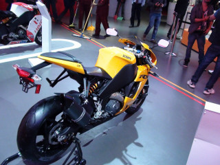 Yellow motorcycle gray floor crowd - path free wallpaper