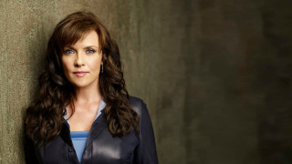 Woman leaning wall eyes closed 2 - a blue top free wallpaper