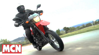 Man riding red motorcycle street - a red motorcycle free wallpaper