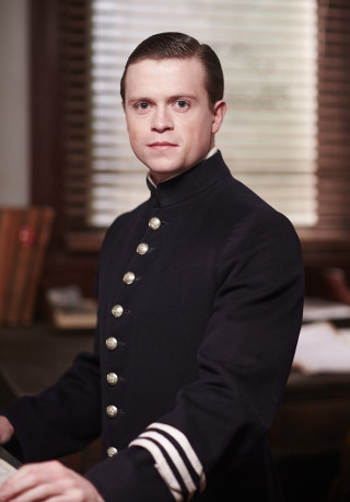 Man uniform sitting desk keyboard - a desk free wallpaper for mobile