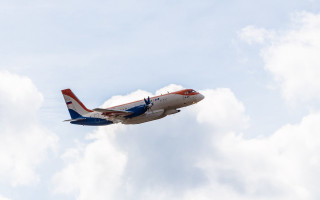 Jetliner red blue tail cloudy - a cloudy blue sky free wallpaper