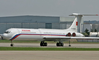 Large white airplane runway building 2 - a large white airplane free wallpaper