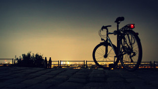 Bicycle parked brick walkway night - a bicycle free wallpaper