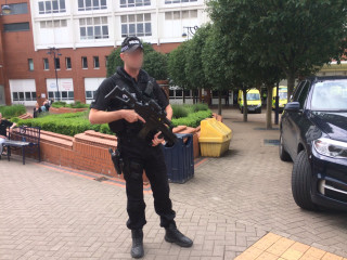 Man police uniform gun courtyard - colin hayes free wallpaper