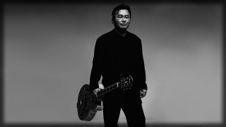 Man holding two guitars black - his free wallpaper for desktop