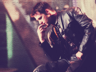 Man sitting wall smoking cigarette - his chin free wallpaper