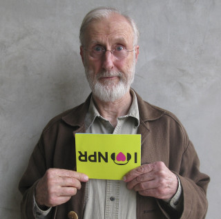 Man holding sign i love - typographic free wallpaper for tablet