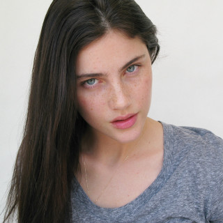 Woman long hair serious look 3 - freckle free wallpaper for tablet